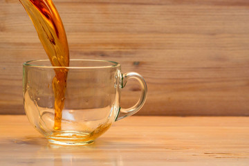 Puring tea in transparent cup