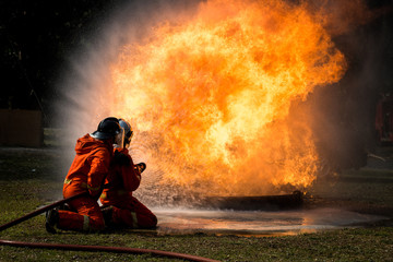 Firefighters training, Team practice to fighting with fire in emergency situation..Spray water to the flame