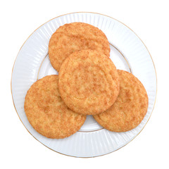 Stack of snickerdoodles in white plate on white
