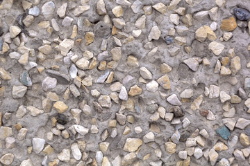 Texture of small stone and plaster. A background of concrete.