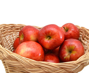 fresh apples in a basket on a white background