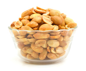 Processed peanuts isolated in glass bowl on white background