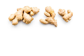 Fototapeta premium Fresh ginger root on white background top view copy space