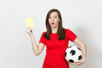 European serious severe young woman, football referee or player in red uniform showing yellow card,...