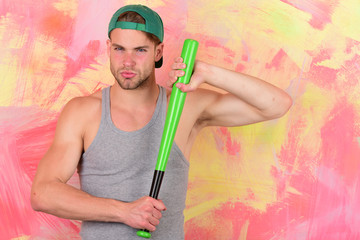 Man in cyan green baseball hat on colorful background