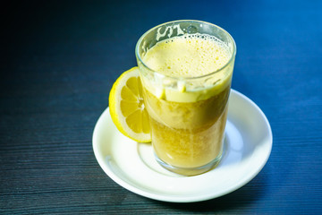 A glass of traditional drink for stamina or energy drink with eggs and tea. Teh talua or teh telor is a tea beverage from West Sumatra. The tea is unique because of the use of egg yolk.