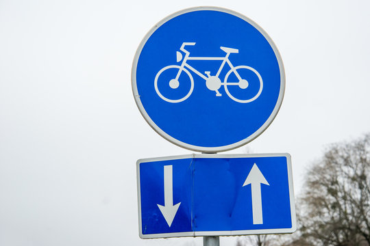 Bicycle lane, round blue road sign 