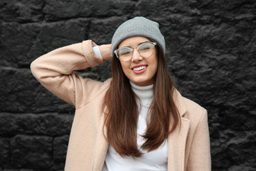 Beautiful smiling woman on dark background