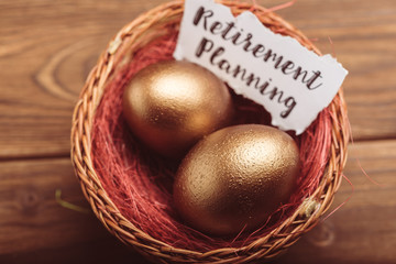 gold eggs on wooden table