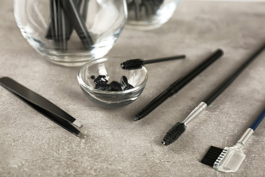 Fototapeta Set of tools for eyebrow dyeing and correction on table