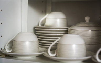 decorated coffee cups and saucers