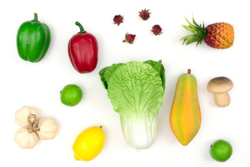 fake varied vegetables and fruits.white background