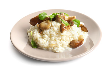 Plate with risotto and mushrooms on white background