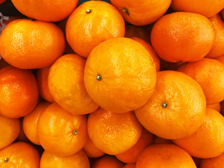 Healthy fruits, orange fruits background many orange fruits - orange fruit background in a supermarket super store