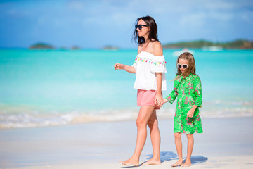Fototapeta premium Beautiful mother and daughter on Caribbean beach