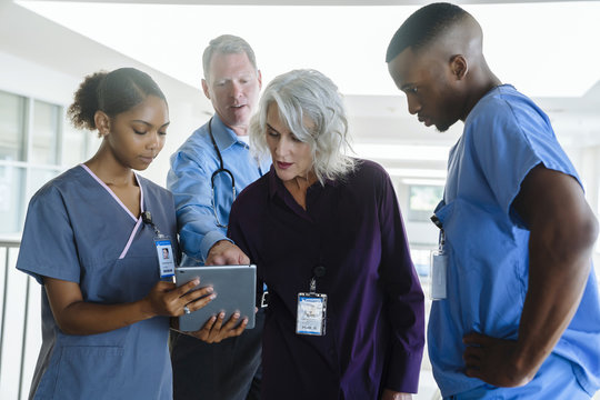 Doctors and nurses using digital tablet