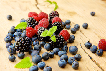 forest berries on a wooden background