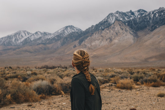 Blonde Woman with Braid in the Mountains