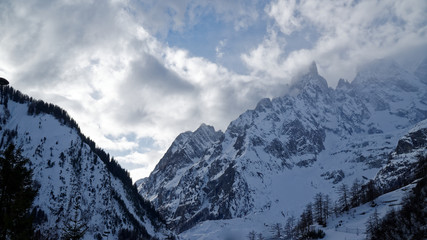 Obraz premium 2902716 Granite mountains covered with snow and winter forest near Mont Blanc Alpes, Italy
