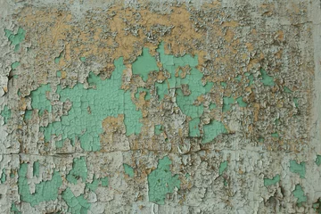Fotobehang Verweerde muur textuur van oude afbladderende verf in scheuren