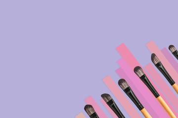 Set of brush makeup on color background.