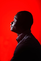 portrait of a african man on red background