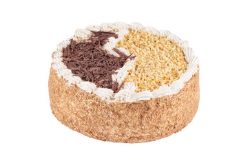 Round tasty cake with coffee cream. Sweet chocolate and nut cake