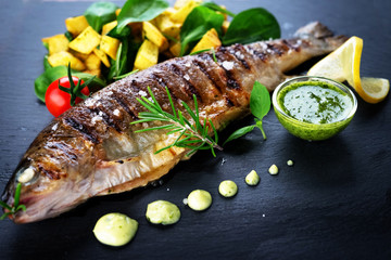 Grilled trout with potato and spinach