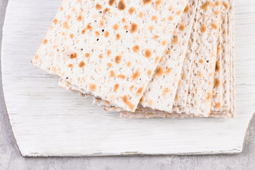 traditional Jewish kosher matzo for Easter pesah on a wooden table.