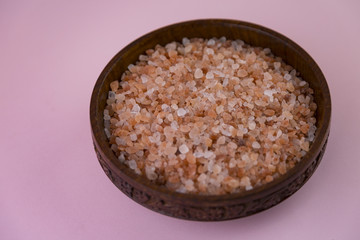 pink Himalayan salt inside a wooden bowl