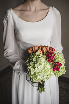 Bride holding her colorful bridal bouquet