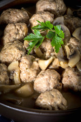 Delicious homemade swedish meatballs with mushroom cream sauce. Small depth of field.