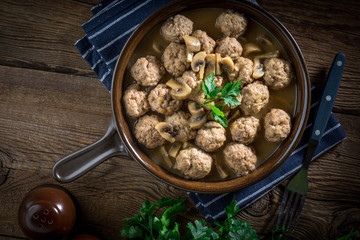 Delicious homemade swedish meatballs with mushroom cream sauce. Small depth of field.