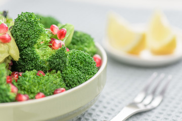 Broccoli salad with pomegranate and guacamole - Healthy meal.