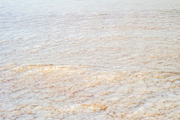Salt in the Dead Sea through the water.