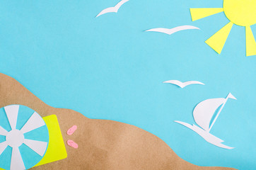 Summer background with sailboat sailing in the sea, beach umbrella and mat. Paper cut.