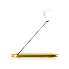 a incense stick with golden tray