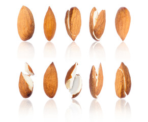 Set of almonds in different positions close-up, isolated on white background