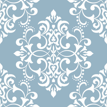 Wallpaper in the style of Baroque. A seamless vector background. White and blue floral ornament. Graphic vector pattern.