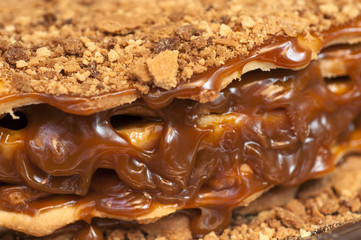 Cake with caramel and nuts, close-up