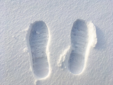 Human Footprints In The White Snow