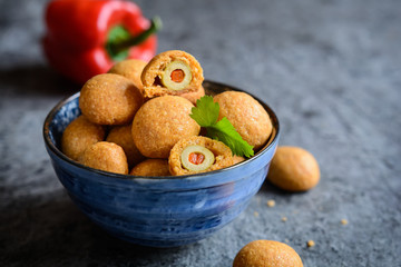 Baked olives in cheese and paprika dough