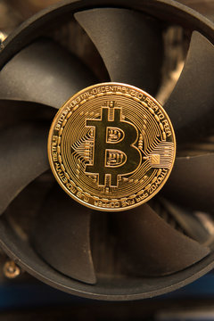 Bitcoin on the fan of a computer graphics card (mining - concept)