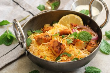 Homemade Chicken Tikka Biryani served with yogurt dip