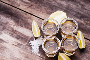 Tequila shots with lime fruits and salt 