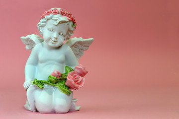 Guardian angel holding flowers