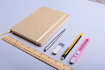 office supplies and gadgets on desk. Top View.