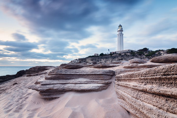 Sunset at Trafalgar beach, nearby lighthouse, where the great battle of Trafalgar took place. Costa...