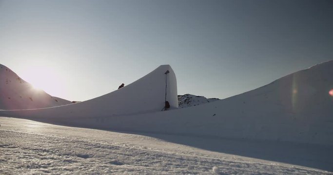 Slow motion, skier goes off jump in Canada