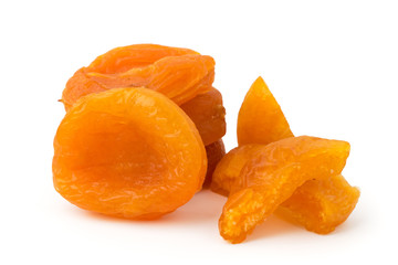 Fototapeta na wymiar Dried apricots and sliced pieces on a white